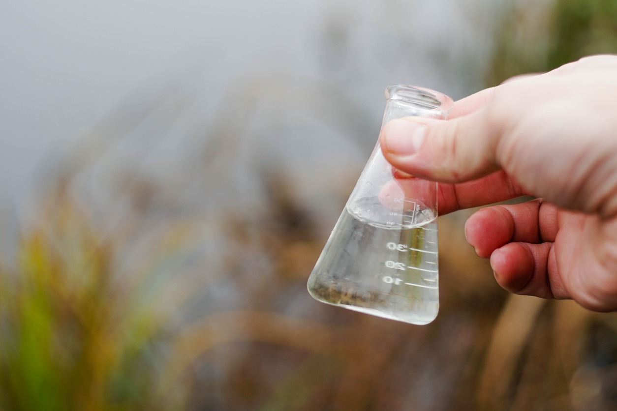 Cloudy water with total suspended solids before treatment