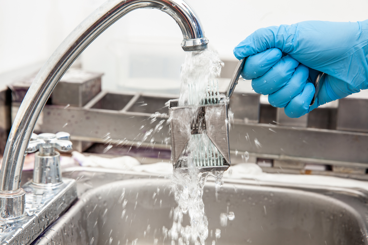 Limescale buildup from hard water on plumbing fixtures