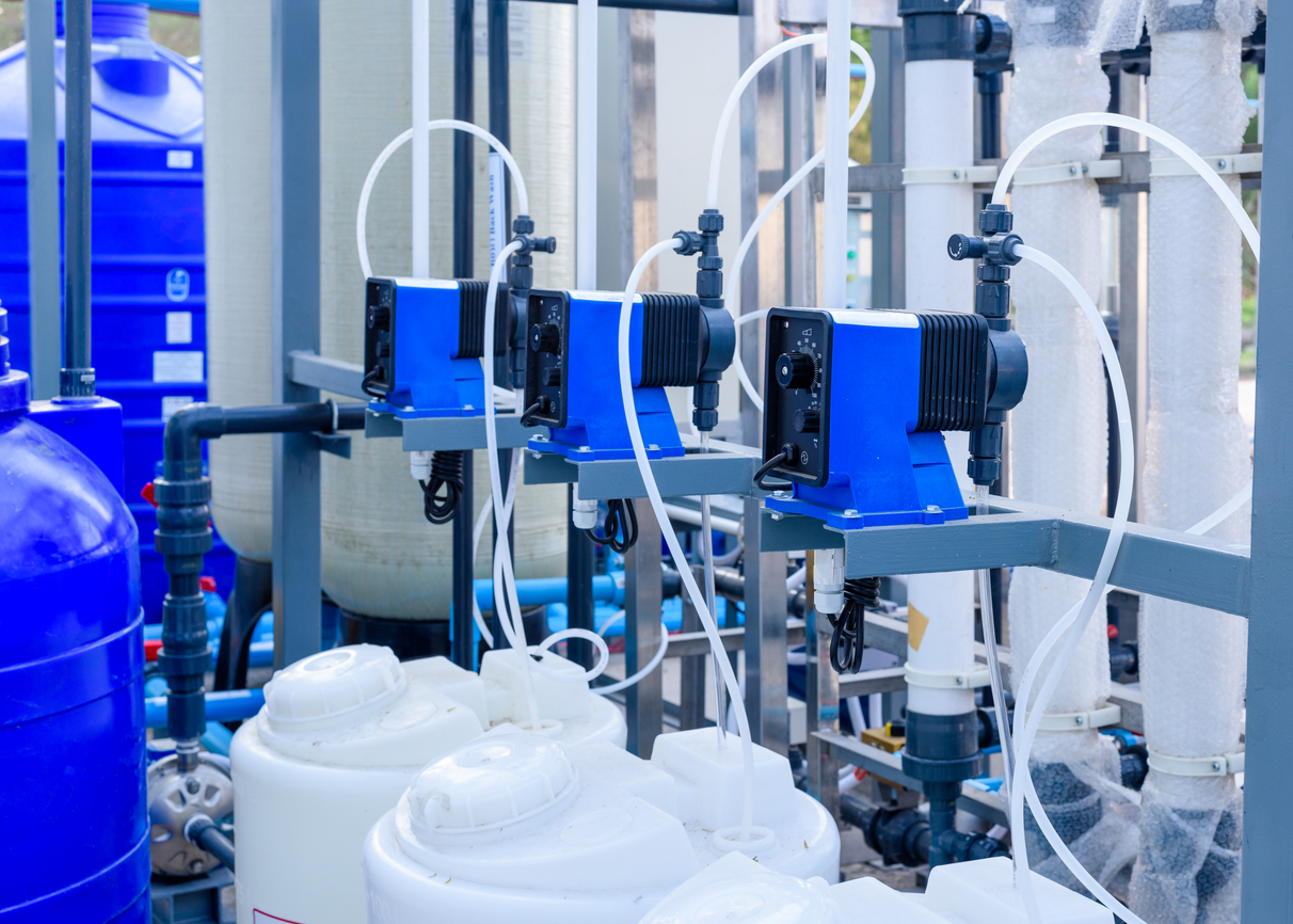 Antiscalant chemical dosing pump alongside an ion exchange softener vessel